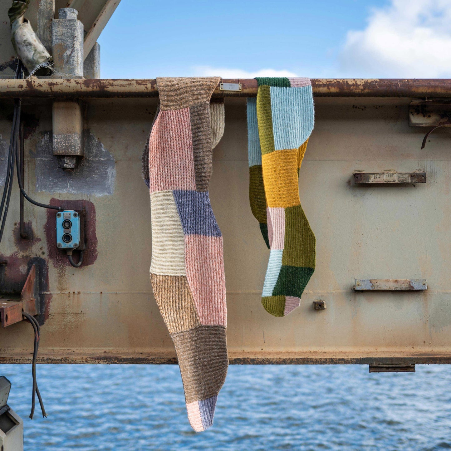 Two different Forming Scarfs hanging at an industrial scenery in the harbour.