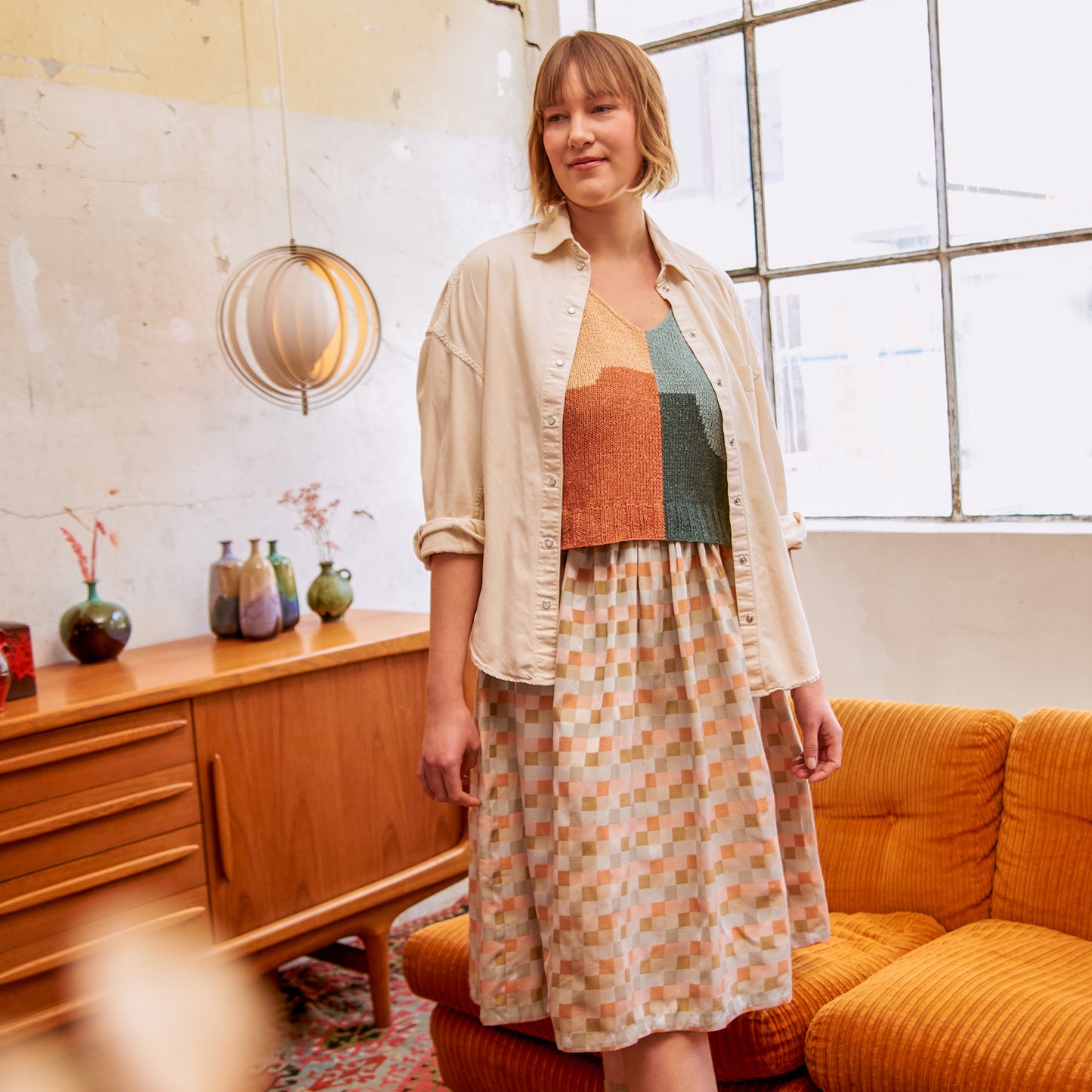 Johanna modeling the Between Ebb And Flow Top from the book Intarsia Knits by Anna Husemann.