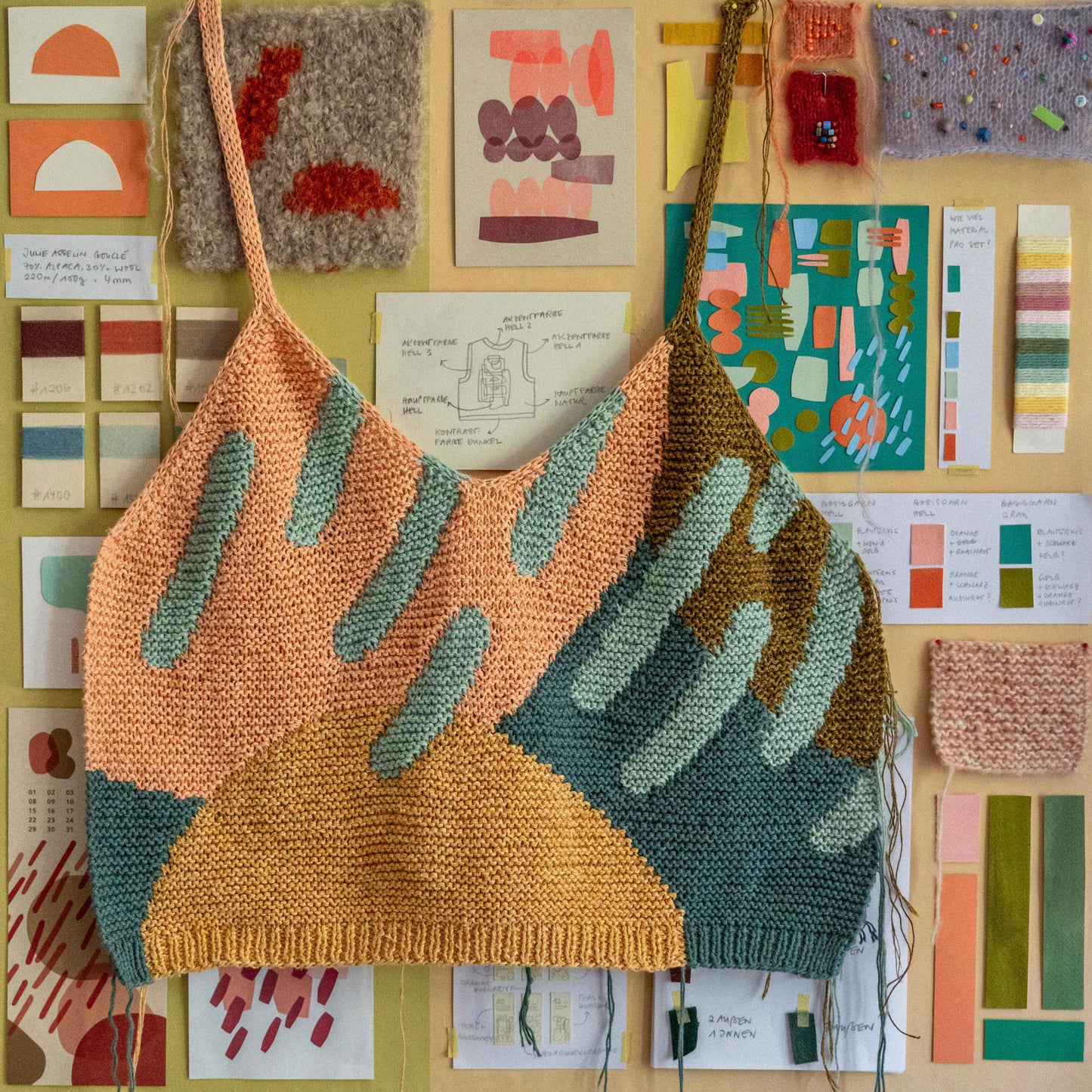 Intarsia Top hung on a wall.