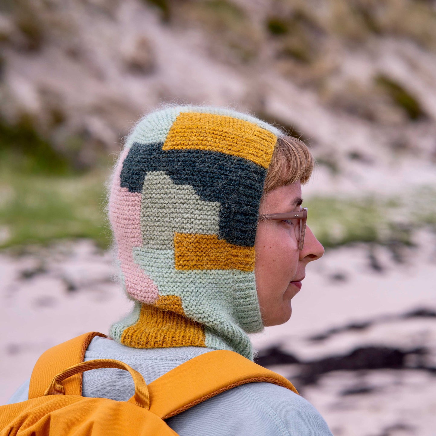 Anna Husemann wearing her Intarsia Balaclava at the coast.